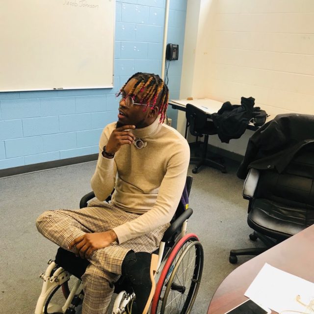 Paris “Tree” Brown, a 25-year-old man, sits in a wheelchair
