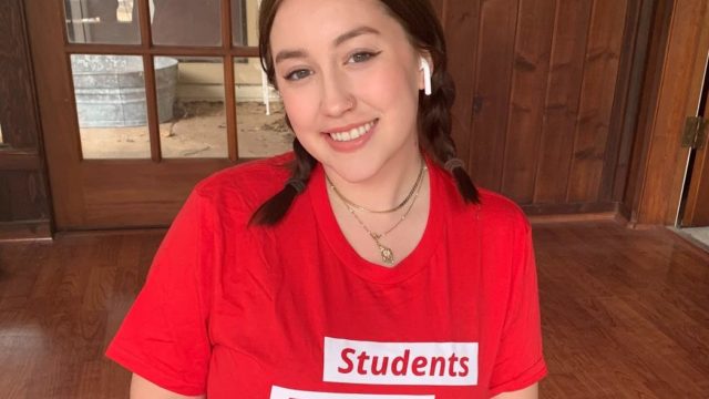 Alanna Miller a volunteer leader wears a Students Demand Action shirt