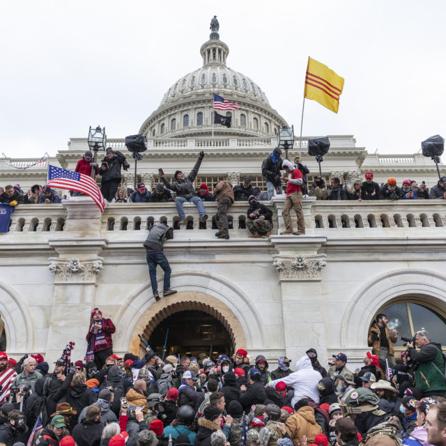 Protesters seen all over Capitol building where pro-Trump supporters riot and breached the Capitol in Washington, DC on January 6, 2021. Rioters broke windows and breached the Capitol building in an attempt to overthrow the results of the 2020 election. Police used buttons and tear gas grenades to eventually disperse the crowd. Rioters used metal bars and tear gas as well against the police.