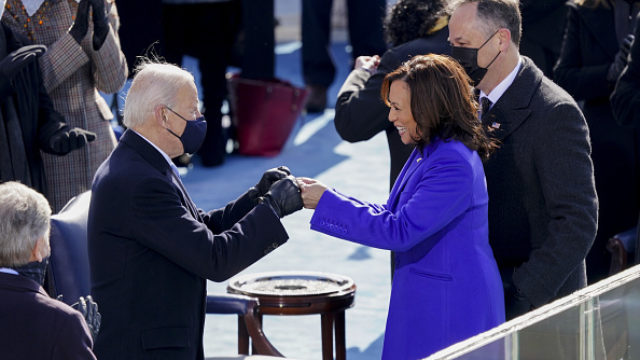 U.S. President Joe Biden, left, fist bumps Vice President Kamala Harris during the 59th presidential inauguration in Washington, D.C., U.S., on Wednesday, Jan. 20, 2021.